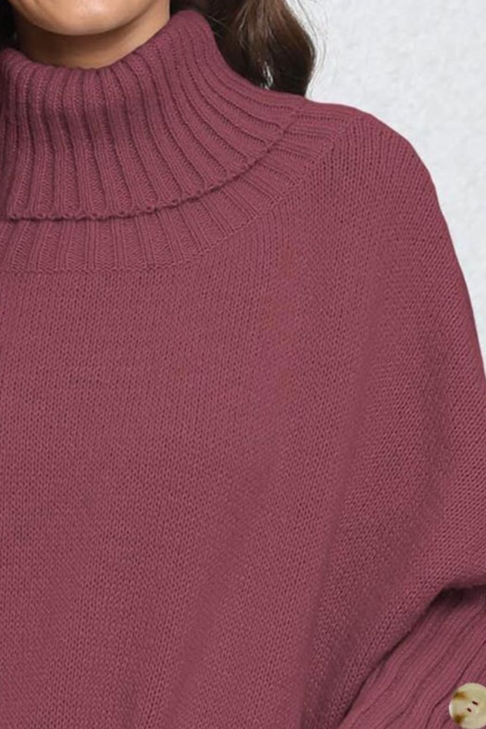 Burgundy turtleneck sweater with ribbed cuffs and button detail