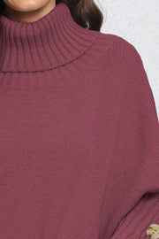 Burgundy turtleneck sweater with ribbed cuffs and button detail