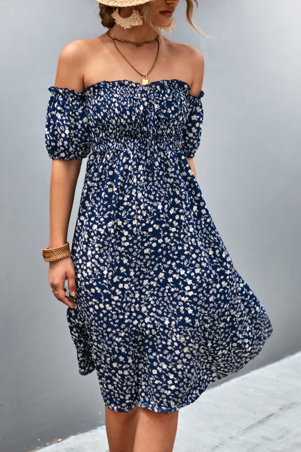 Dark blue floral midi dress with smocked bodice and bubble sleeves, off-the-shoulder neckline
