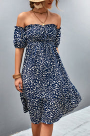 Dark blue floral midi dress with smocked bodice and bubble sleeves, off-the-shoulder neckline
