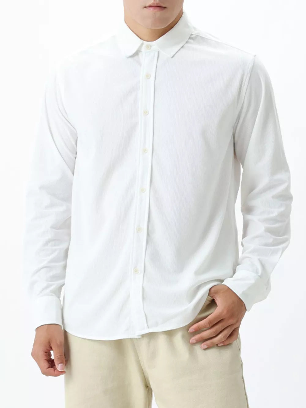 White long sleeve buttoned shirt with subtle texture and spread collar.