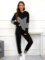 Black houndstooth hoodie and pants set with drawstring and chevron detail.