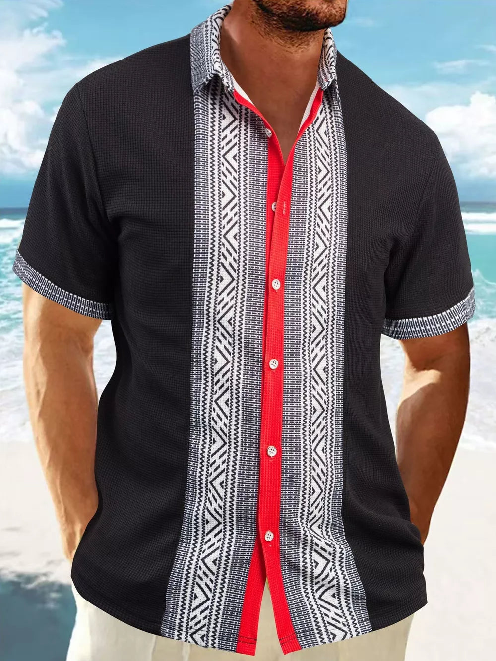 Men's black short sleeve shirt with bold geometric print panels and red placket.