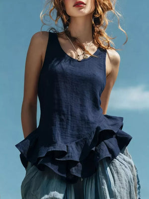 Navy blue sleeveless tank top with ruffled hem detail.