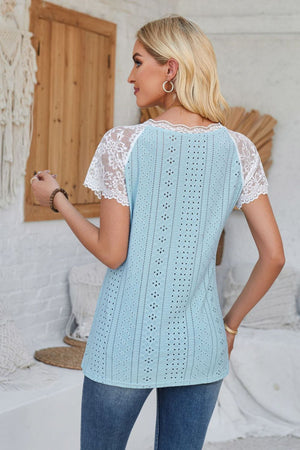 Aqua eyelet raglan blouse with white lace sleeves and scalloped trim.
