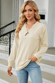 Cream textured cable-knit henley pullover with button detail and V-neck