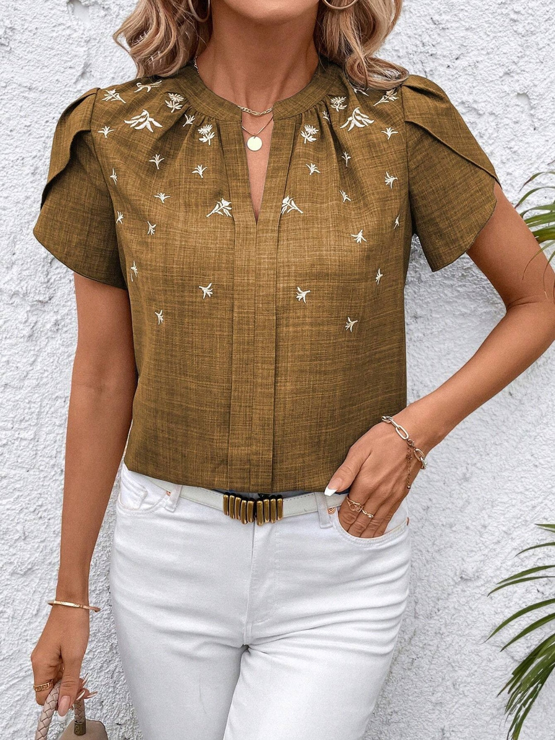 Matcha green embroidered floral keyhole blouse with short flutter sleeves.