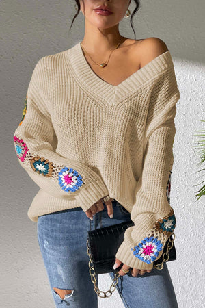 Cream v-neck sweater with colorful crochet granny square sleeve details, 100% acrylic