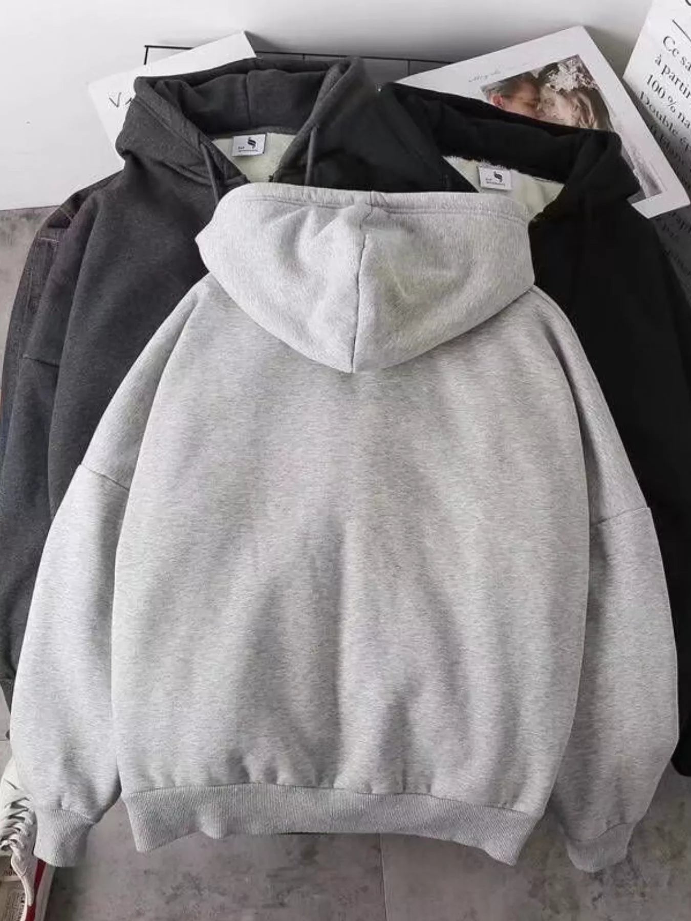 Men's gray fleece-lined zip-up hoodie with a hood and ribbed cuffs.