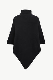 Black acrylic knit poncho with turtleneck and button details on the sleeve.
