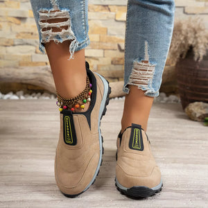 Khaki suede-like round toe slip-on sneakers with black trim and "OUTDOOR" detail.