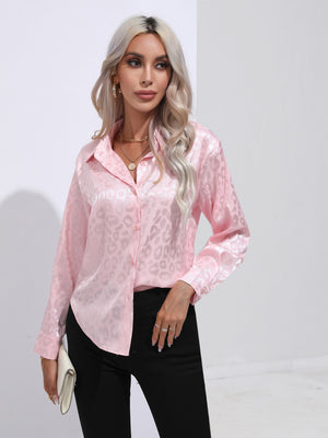 Blush pink satin leopard print blouse with button front and collared neckline.