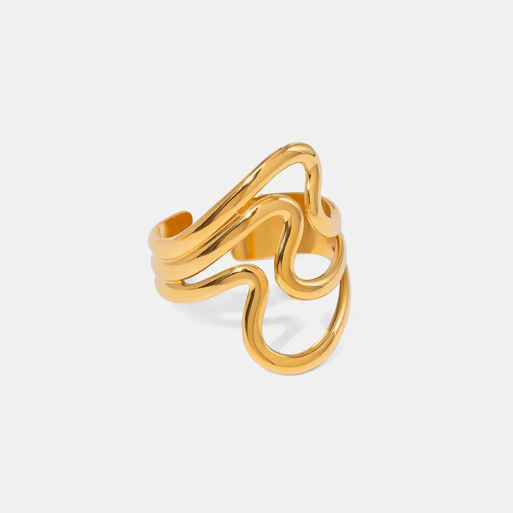 Gold sculptural wave ring with abstract design
