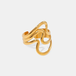 Gold sculptural wave ring with abstract design