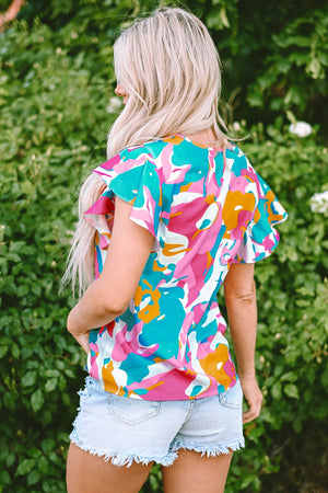 Abstract print blouse with ruffle sleeves in Aqua, pink, orange, and white.