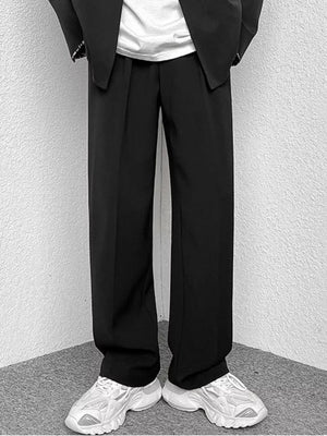 Black wide-leg casual pants with a relaxed fit, styled with a blazer and sneakers.