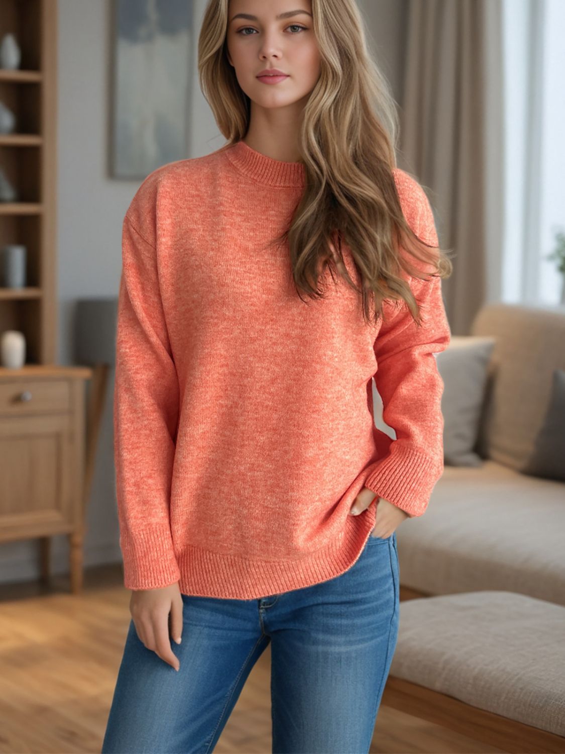 Textured knit crew neck pullover sweater in orange with ribbed cuffs and hem.