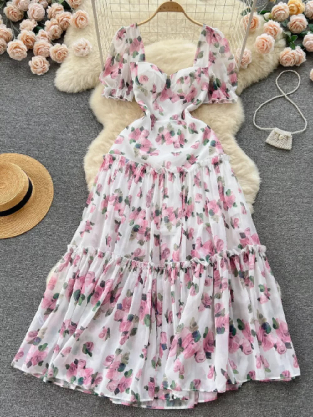 White floral midi dress with puff sleeves and ruffle hem