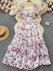 White floral midi dress with puff sleeves and ruffle hem