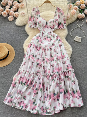 White floral midi dress with puff sleeves and ruffle hem