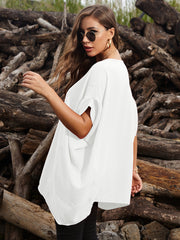 White draped asymmetrical sleeve blouse with a relaxed fit and casual styling.