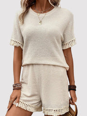 Cream waffle knit set with fringe trim shorts and short sleeve top.