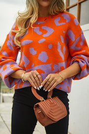 Orange and purple colorblock leopard print acrylic sweater with balloon sleeves.