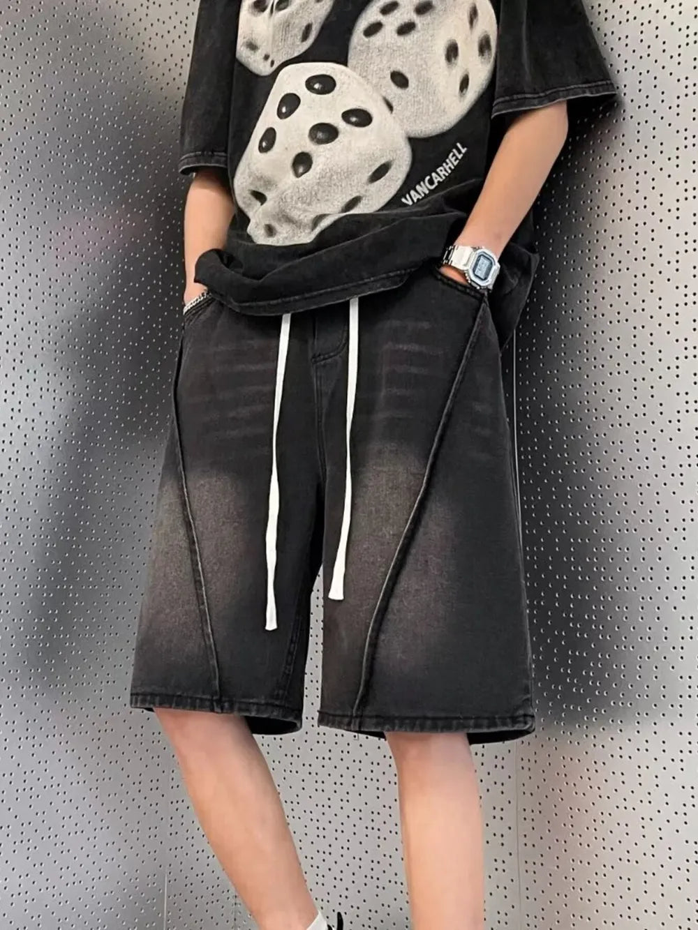 Black denim shorts with white drawstring and contrast stitching detail.
