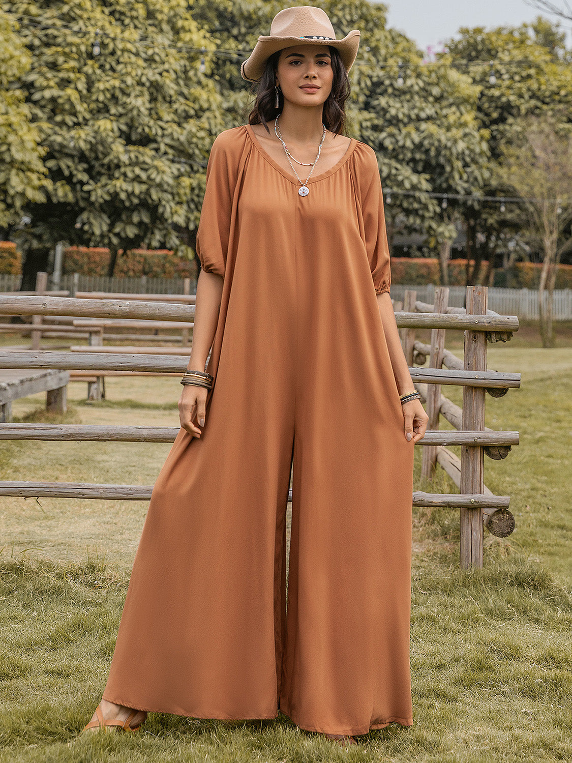 Caramel gathered sleeve wide-leg jumpsuit with a scoop neckline.