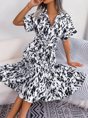 Dalmatian print midi shirt dress with short sleeves, collar, and tie waist.