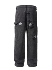 Dark embroidered star carpenter jeans with checkered pattern details.
