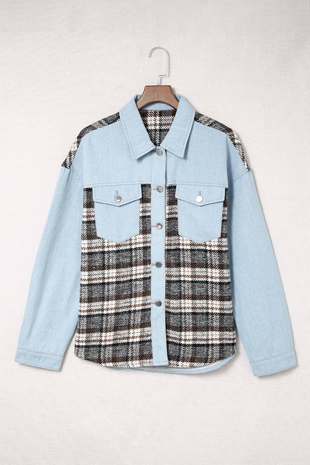 Light blue denim trucker jacket with plaid paneling and chest pockets
