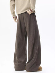 Brown wide-leg sweatpants with adjustable drawstring waist and pockets.