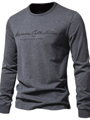 Dark gray crewneck long sleeve t-shirt with scripted "Aspen Collection Established 1980" graphic.
