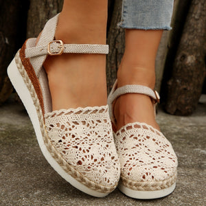Ivory crochet espadrille sandals with ankle strap and jute trim.