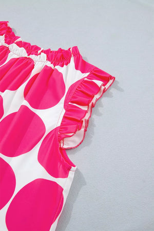 Polyester tank top with pink polka dots and ruffled trim.
