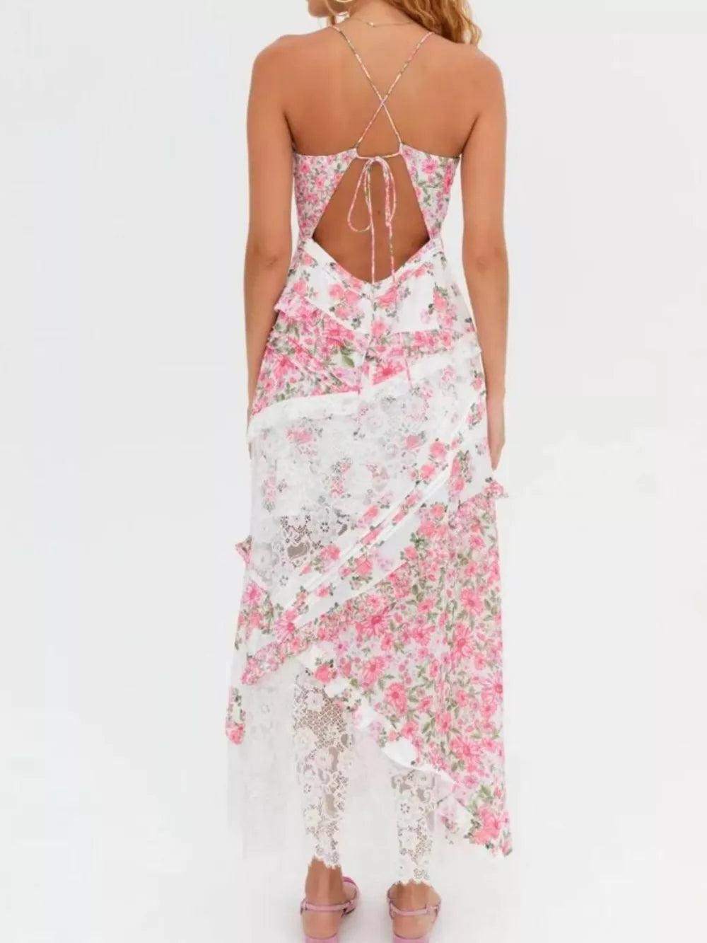 Maxi dress with floral print, lace trim, and open back with tie detail.