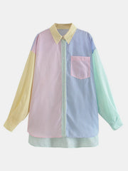 Oversized colorblock striped button-down shirt with pastel panels and a chest pocket.