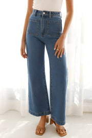 Sailor-inspired wide-leg denim trousers in medium wash with large front patch pockets.