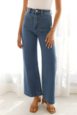 Sailor-inspired wide-leg denim trousers in medium wash with large front patch pockets.