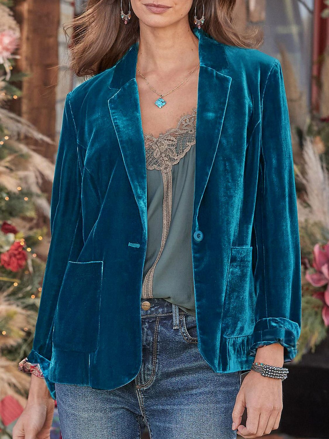 Peacock blue velvet blazer with rolled cuff detail and buttoned front.