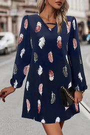 Navy feather print mini dress with cutout neckline and long sleeves