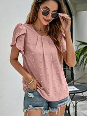 Pink textured puff sleeve dot blouse with a round neckline and pleated front.