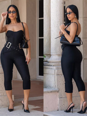Black strapless cinched-waist jumpsuit with belted detail and cropped pants.