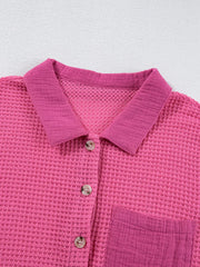 Waffle-knit button-down shirt in cerise with a chest pocket and button details.