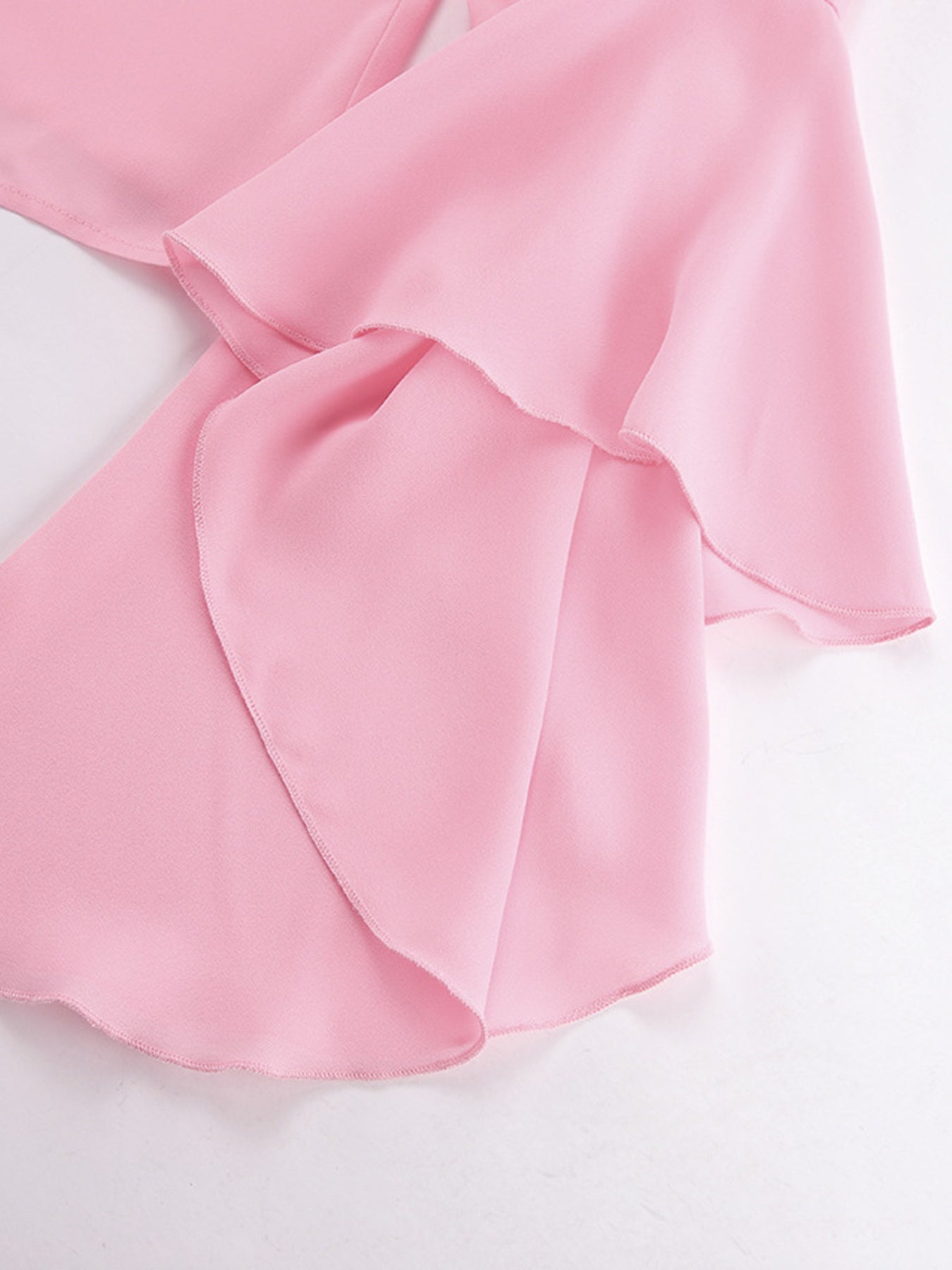 Pink ruffled flounce sleeve blouse with airy, casual style.