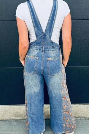 Denim overalls with vintage floral print side panels and back pockets.