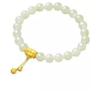 18k gold-plated bead bracelet with a tassel detail and gold-tone beads.