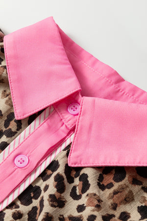 Print short sleeve shirt with leopard pattern and pink collar and buttons.