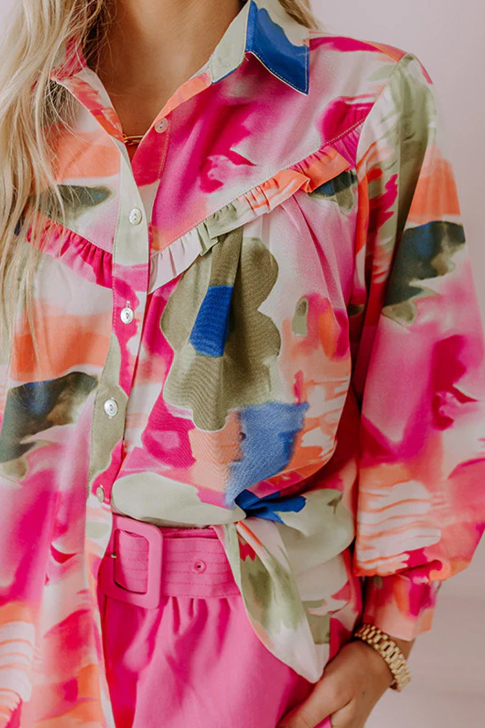 Painterly ruffle front blouse in abstract pink print with button-up closure and long sleeves